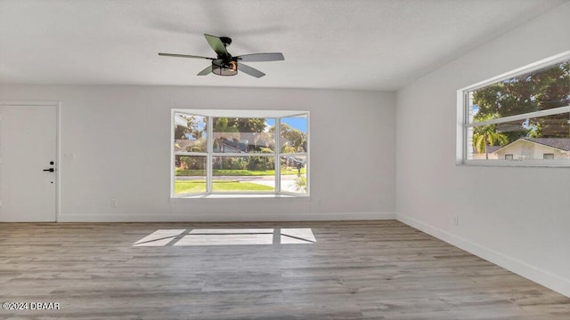 empty room featuring light hardwood / wood-style floors and ceiling fan