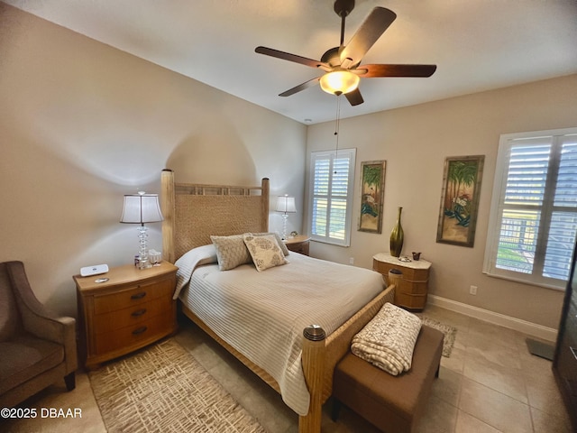 bedroom with baseboards, ceiling fan, and light tile patterned flooring