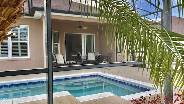 view of pool featuring ceiling fan and a patio