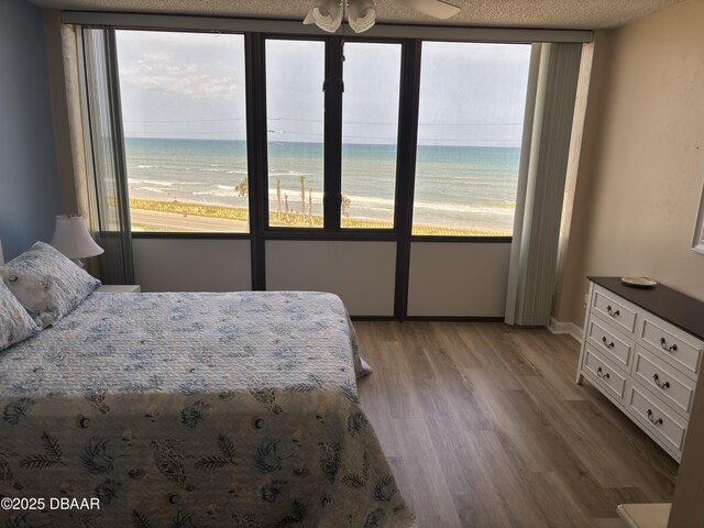3580 S Ocean Shore Blvd Unit 404, Flagler Beach, FL 32136 - bedroom featuring multiple windows and light wood finished floors