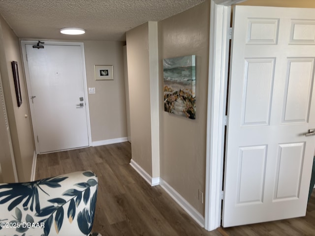 3580 S Ocean Shore Blvd Unit 404, Flagler Beach, FL 32136 - corridor with wood finished floors, a textured ceiling, and baseboards