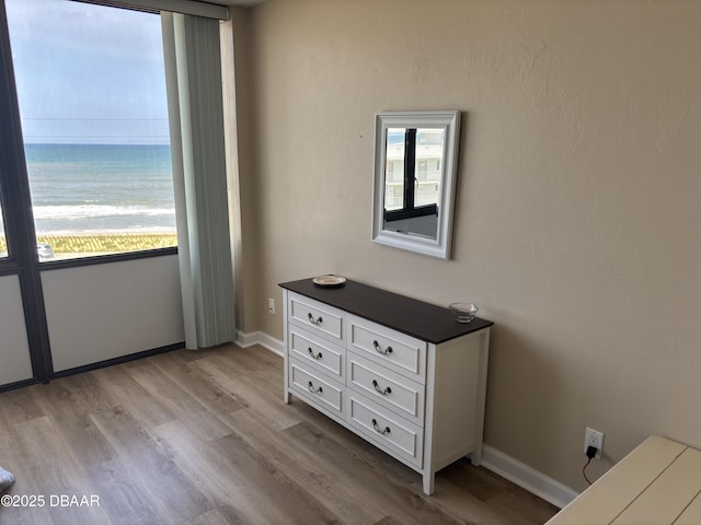 3580 S Ocean Shore Blvd Unit 404, Flagler Beach, FL 32136 - bedroom with light wood-style floors and baseboards