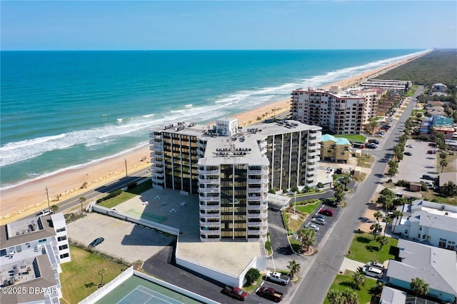 aerial view with a view of the beach and a water view