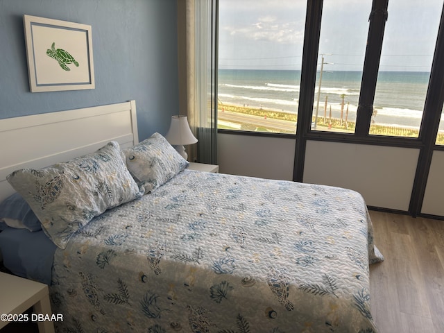 3580 S Ocean Shore Blvd Unit 404, Flagler Beach, FL 32136 - bedroom with wood finished floors and a water view