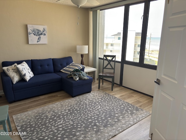 3580 S Ocean Shore Blvd Unit 404, Flagler Beach, FL 32136 - living room featuring ceiling fan and wood finished floors