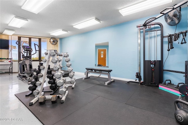 gym with a textured ceiling