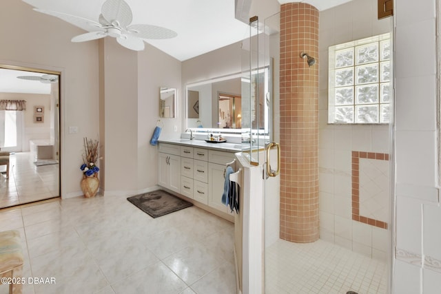 bathroom featuring vanity, tile patterned flooring, and walk in shower