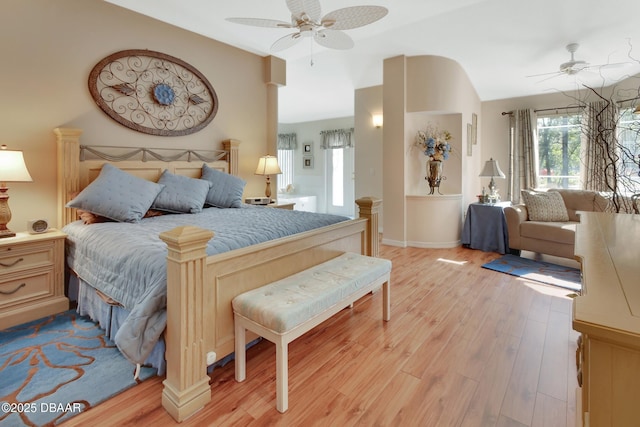 bedroom featuring ceiling fan, lofted ceiling, and light hardwood / wood-style floors