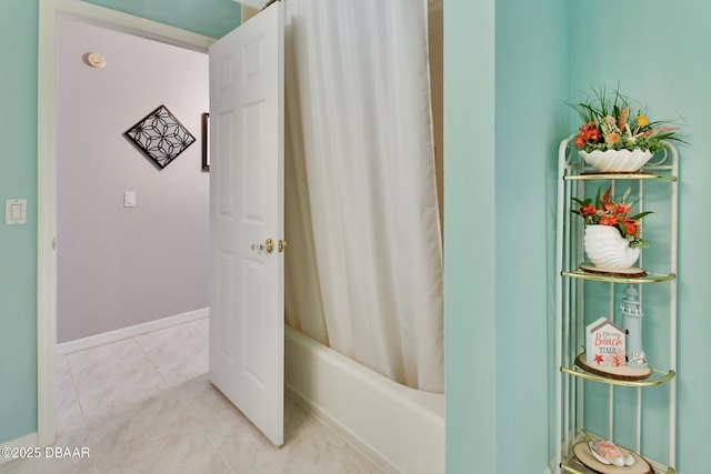 bathroom featuring tile patterned floors and shower / tub combo