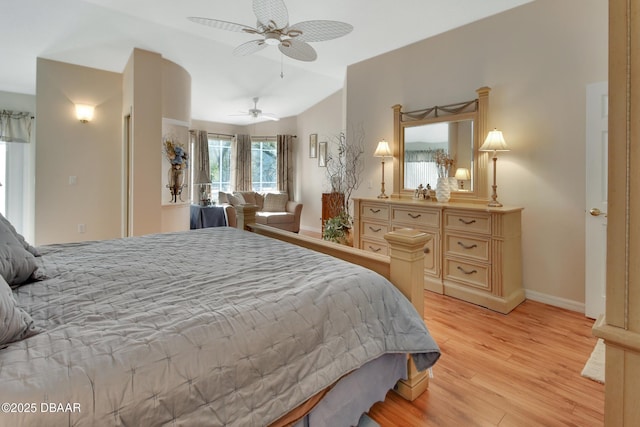 bedroom featuring vaulted ceiling, light hardwood / wood-style floors, and ceiling fan