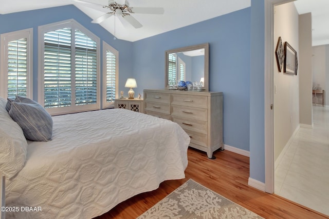 bedroom with ceiling fan and light hardwood / wood-style flooring