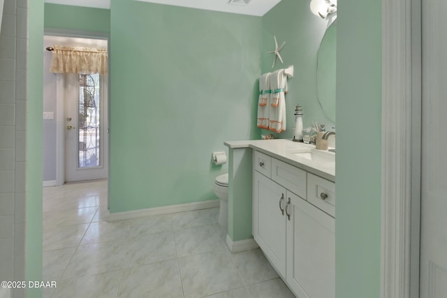 bathroom with tile patterned floors, vanity, and toilet