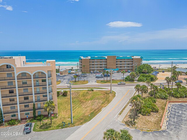 aerial view with a water view and a view of the beach