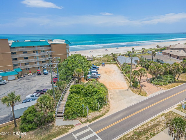 aerial view with a view of the beach and a water view