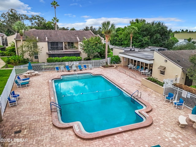 view of swimming pool with a patio