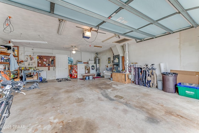 1713 Caldwell Rd, South Daytona, FL 32119 - garage with a garage door opener, a workshop area, water heater, and washing machine and dryer