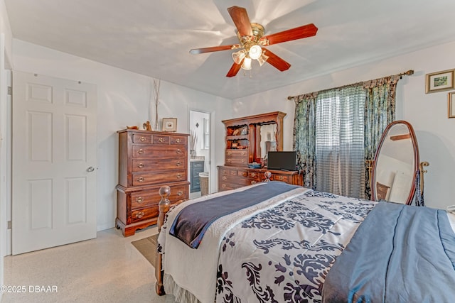 1713 Caldwell Rd, South Daytona, FL 32119 - bedroom with a ceiling fan, ensuite bathroom, and speckle patterned floor