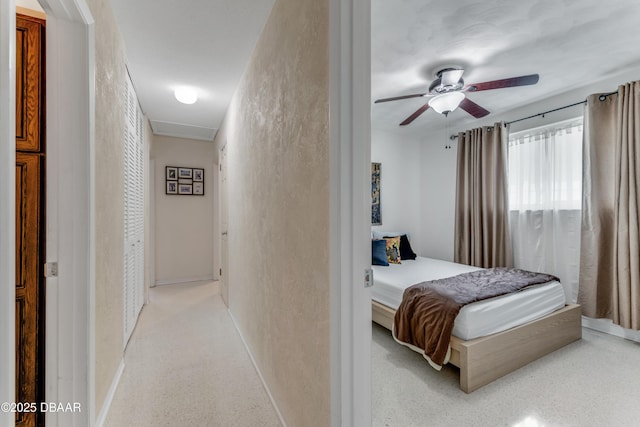 1713 Caldwell Rd, South Daytona, FL 32119 - bedroom featuring multiple windows, baseboards, a textured wall, and ceiling fan