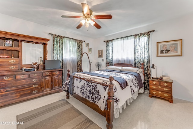 1713 Caldwell Rd, South Daytona, FL 32119 - bedroom featuring light colored carpet, ceiling fan, and baseboards