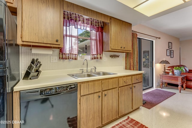 1713 Caldwell Rd, South Daytona, FL 32119 - kitchen featuring black appliances, a sink, light countertops, tasteful backsplash, and dark aggregate flooring