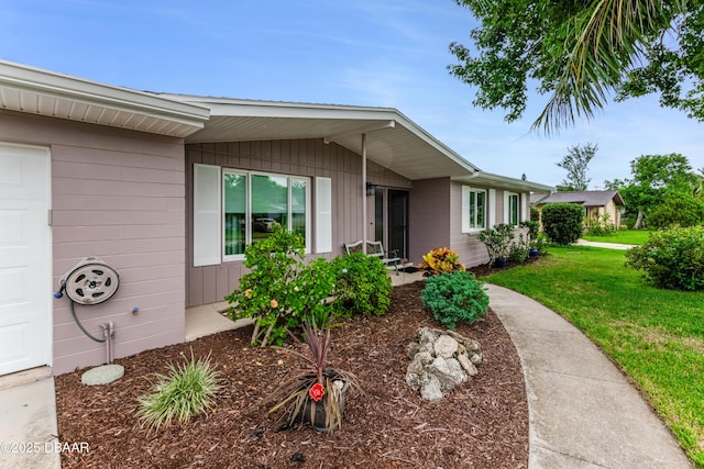1713 Caldwell Rd, South Daytona, FL 32119 - view of front of property featuring a front yard and an attached garage