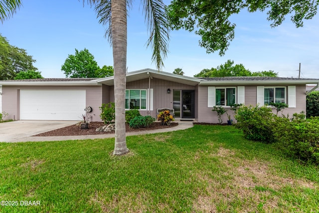 1713 Caldwell Rd, South Daytona, FL 32119 - ranch-style house with driveway, an attached garage, and a front yard