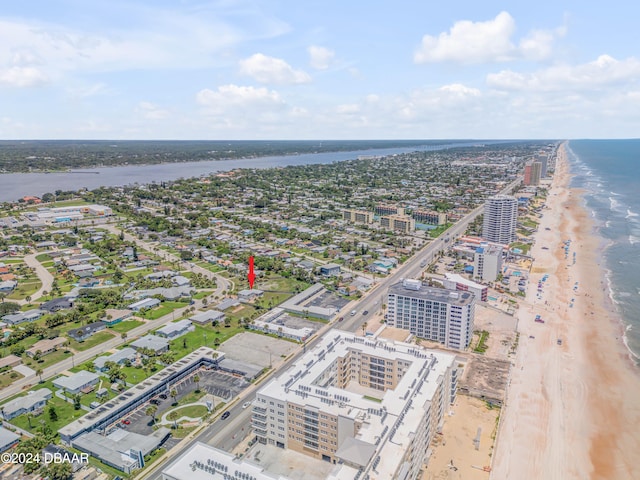 bird's eye view featuring a view of the beach and a water view