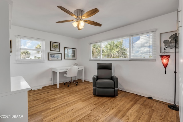 office area featuring light hardwood / wood-style flooring and ceiling fan