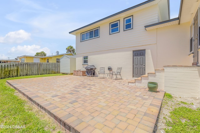 rear view of house with a patio