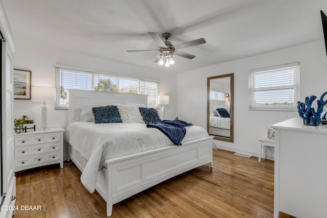 bedroom with ceiling fan and light wood-type flooring