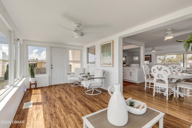 sunroom with ceiling fan and plenty of natural light