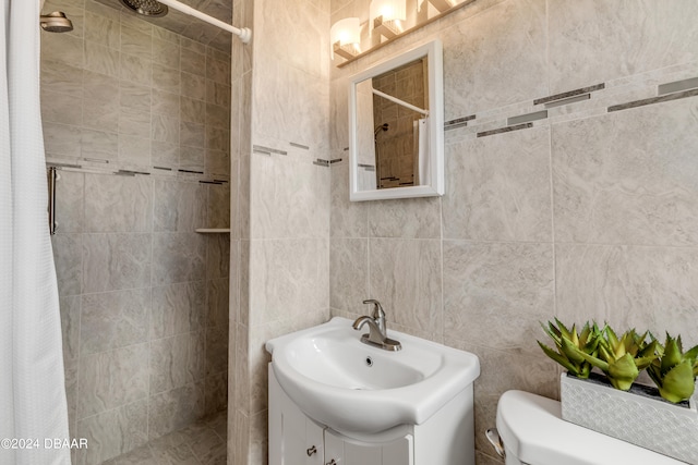 bathroom featuring tile walls, vanity, toilet, and a shower with curtain