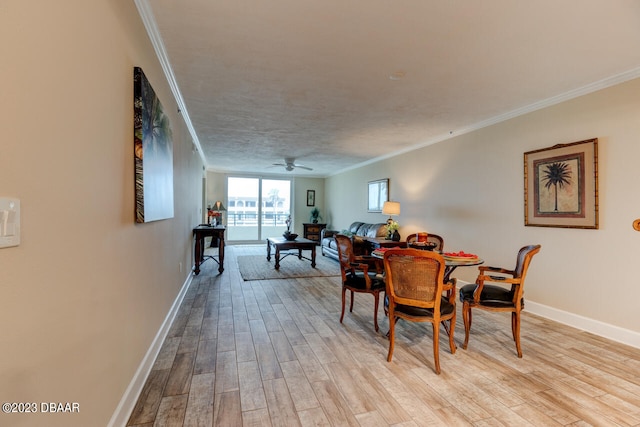 dining room featuring ornamental molding, ceiling fan, a textured ceiling, and light hardwood / wood-style floors