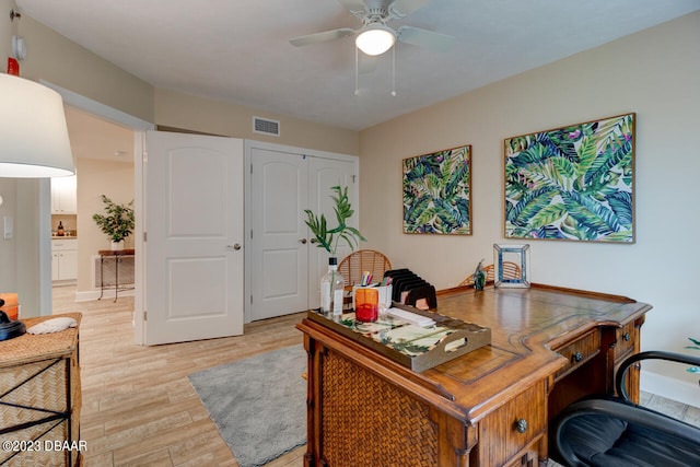 home office featuring ceiling fan and light wood-type flooring