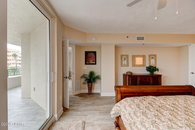 bedroom with light wood-type flooring and ceiling fan