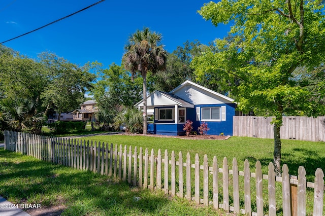 view of front of home with a front lawn