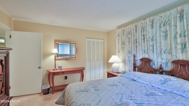 bedroom featuring ornamental molding, a textured ceiling, light carpet, and a closet