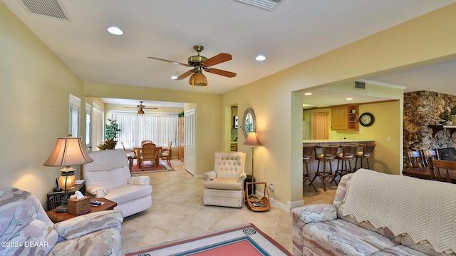 living room with ceiling fan