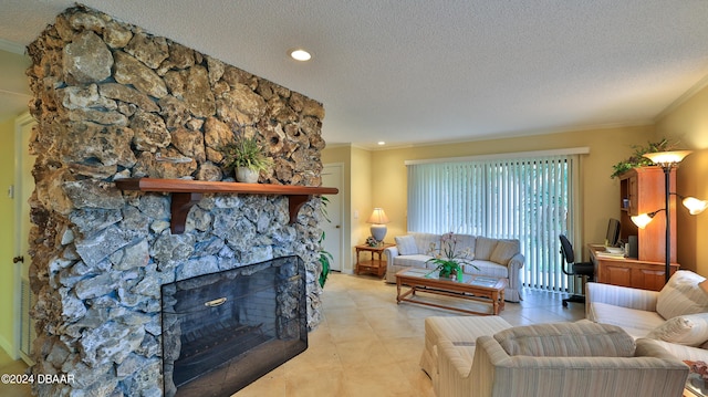 tiled living room featuring ornamental molding, a fireplace, and a textured ceiling