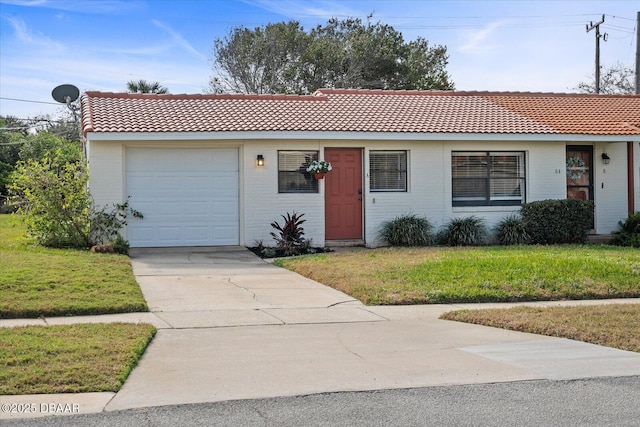 ranch-style home with a garage and a front yard