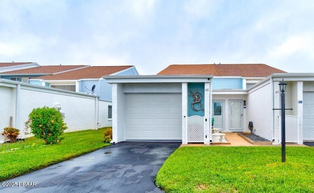 single story home with a garage and a front yard