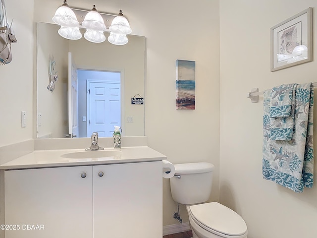 bathroom with toilet and vanity