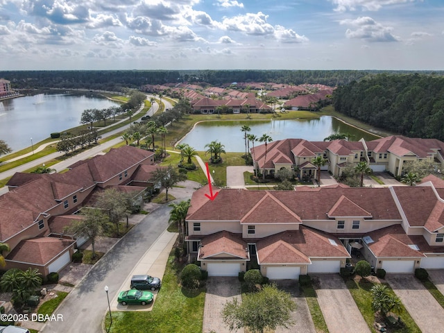 aerial view with a water view and a residential view