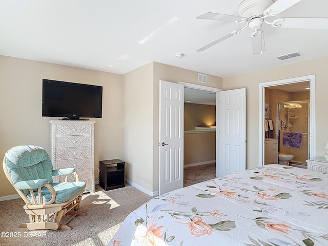 carpeted bedroom with baseboards, visible vents, ensuite bathroom, and ceiling fan