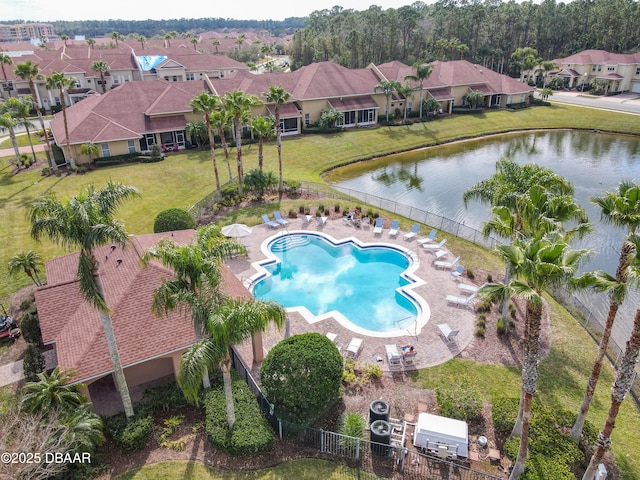 bird's eye view featuring a residential view and a water view