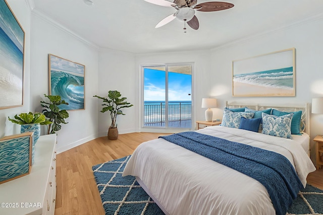 2515 S Atlantic Ave Unit 507, Daytona Beach Shores, FL 32118 - bedroom with access to exterior, light wood-style floors, a water view, crown molding, and a ceiling fan