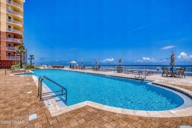 2515 S Atlantic Ave Unit 507, Daytona Beach Shores, FL 32118 - community pool featuring a patio area