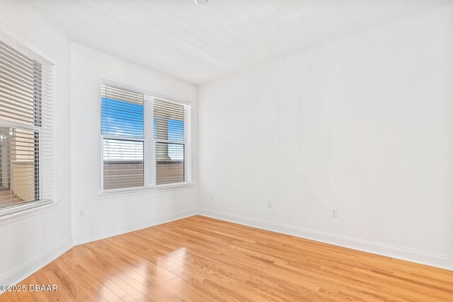 2515 S Atlantic Ave Unit 507, Daytona Beach Shores, FL 32118 - unfurnished room featuring light wood-style flooring and baseboards