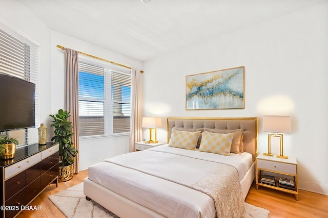 2515 S Atlantic Ave Unit 507, Daytona Beach Shores, FL 32118 - bedroom featuring light wood-type flooring and multiple windows