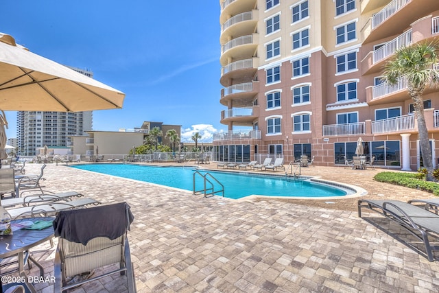 2515 S Atlantic Ave Unit 507, Daytona Beach Shores, FL 32118 - community pool featuring a patio
